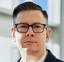 Alexander Hughes, generální ředitel kryptoměnové obchodní společnosti, portrét.